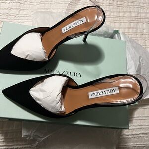 Aquazzura's V Plexi pumps flaunt a suede and a translucent PVC slingback.